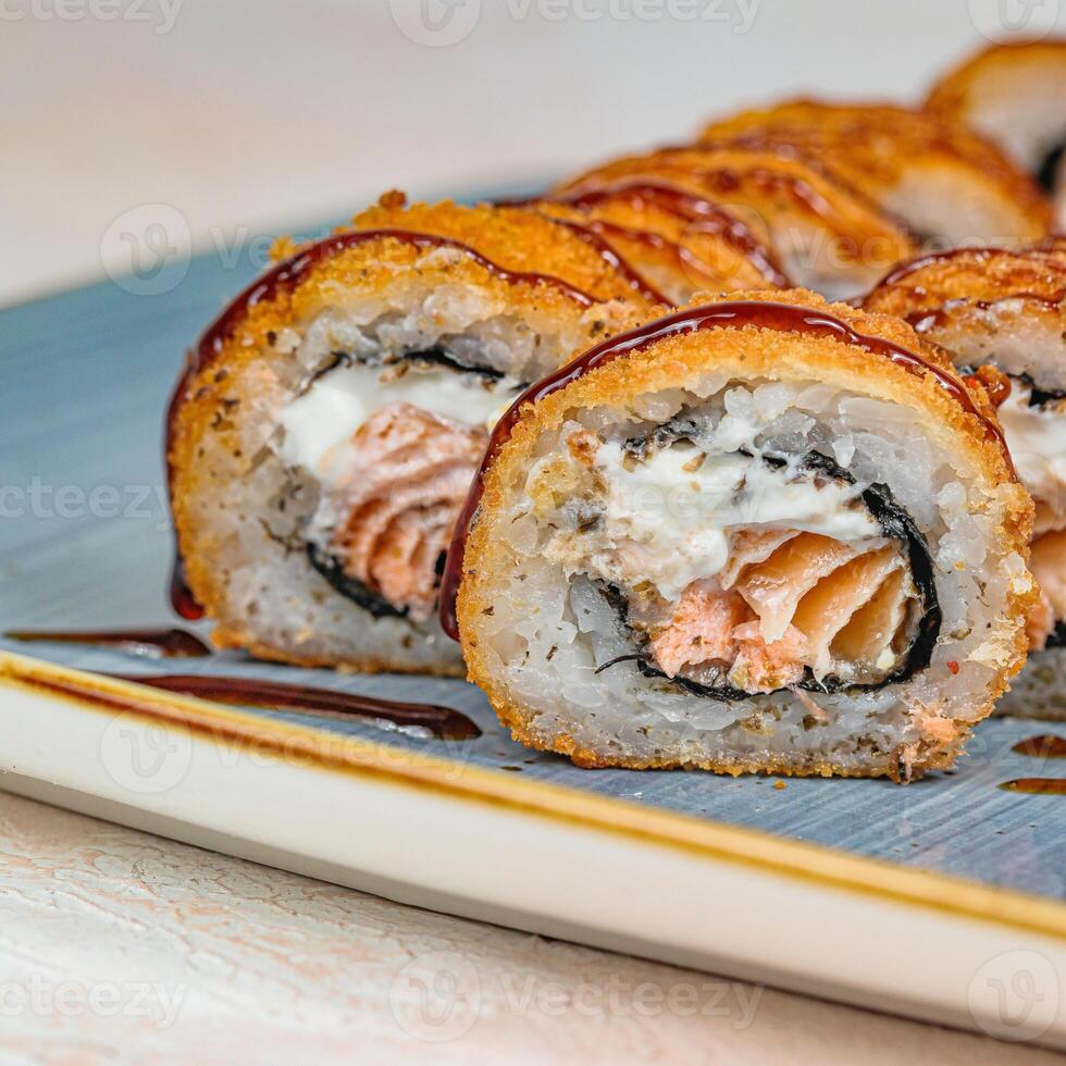 Freshly Prepared Sushi Plate With Assorted Rolls and Sashimi photo