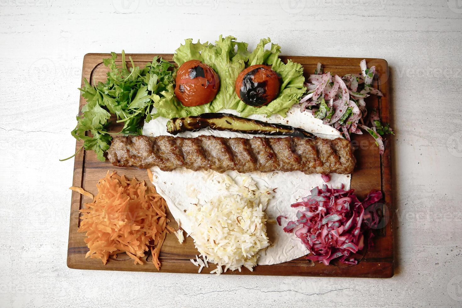 Wooden Cutting Board With Assorted Meat and Fresh Vegetables photo