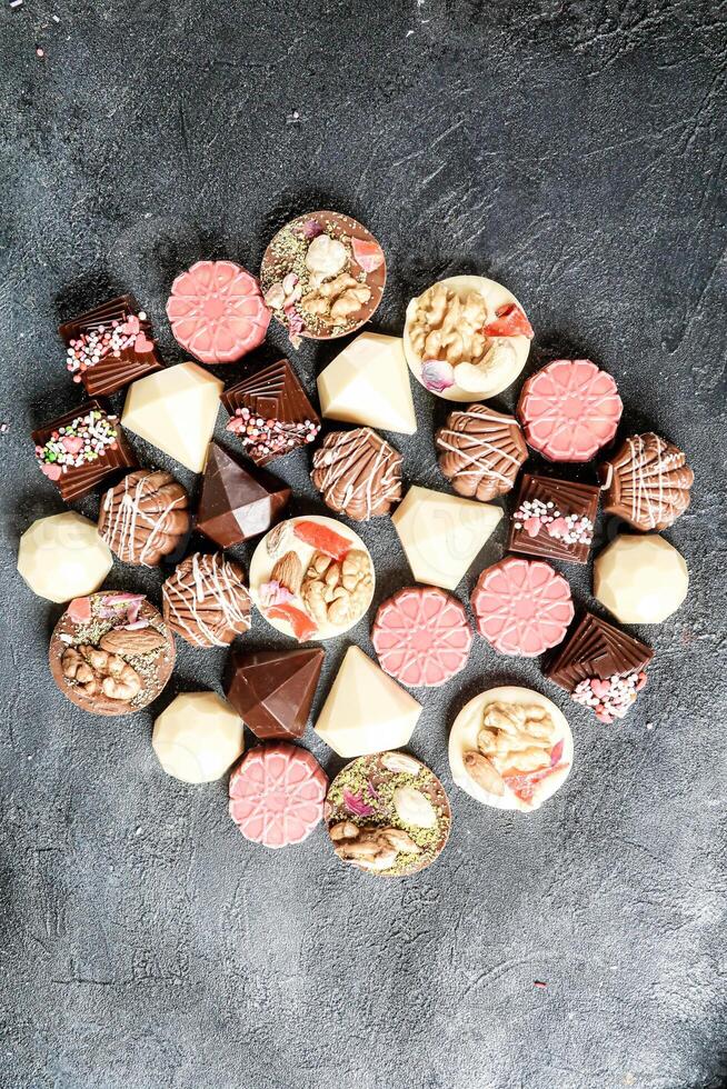 Assorted Chocolates Piled on Table photo