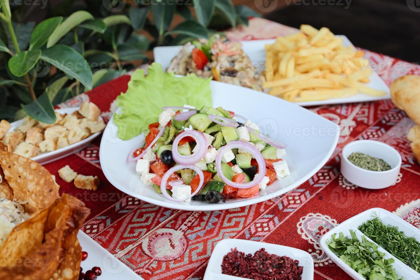 Plates of Delicious Food on Table photo