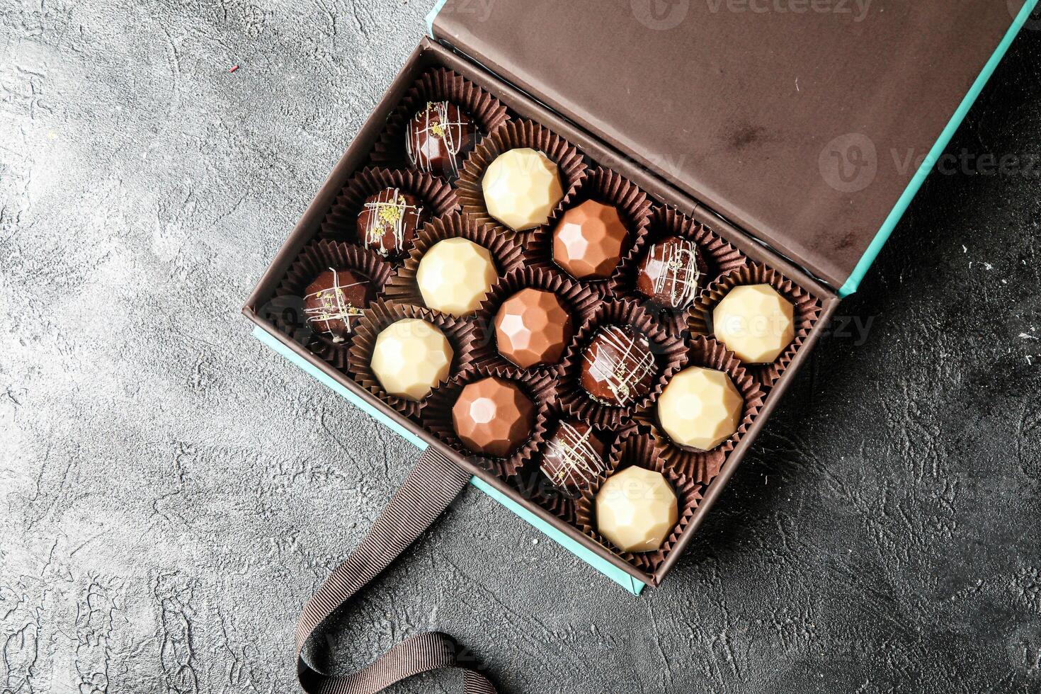 Assorted Chocolates Box on Table photo