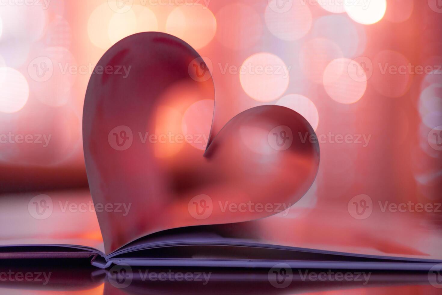 Closeup love Valenstines day design. Perfect heart shape book pages romantic. Vintage style copy space text lights reflections. Beautiful February Valentine day artistic background. Couple anniversary photo