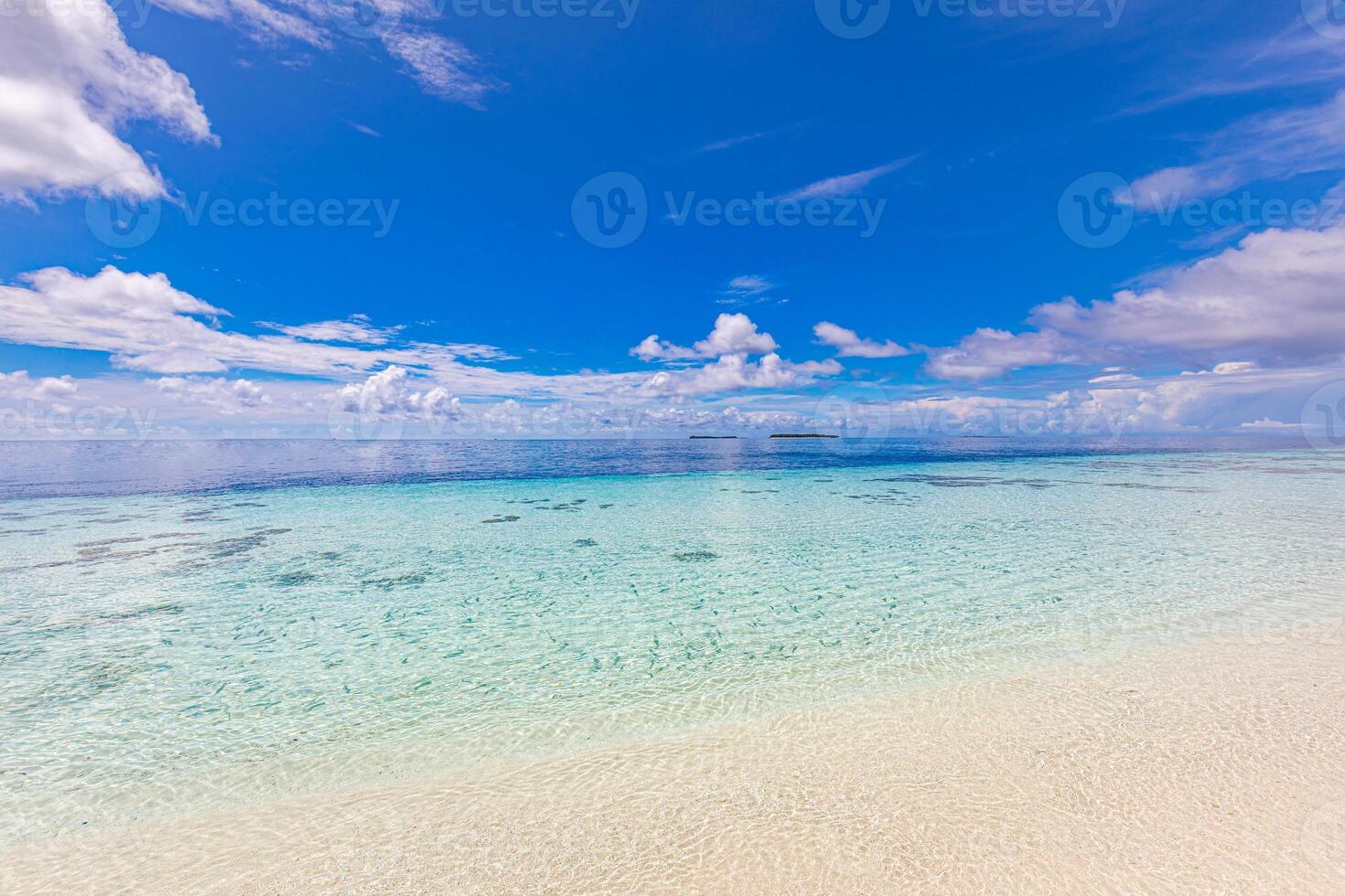 Tropical beach view. Calm and relaxing empty beach scene, blue sky and white sand. Tranquil nature concept. Soft serene waves splashing, summer Mediterranean seaside landscape. Sunny peaceful coast photo