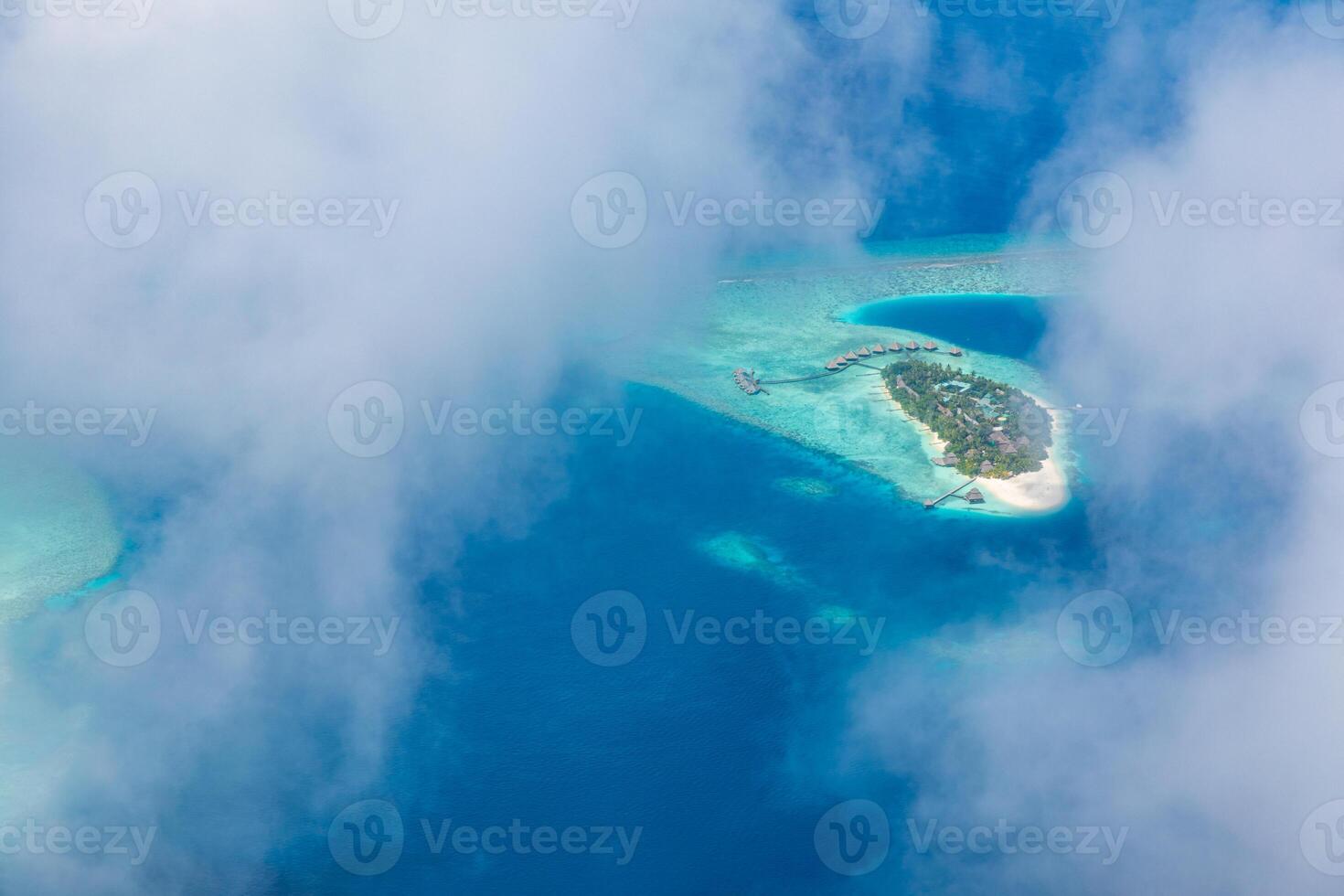 Aerial view on Maldives island, Ari atoll. Tropical islands and atolls in Maldives from aerial view. Summer vacation holiday landscape background. photo