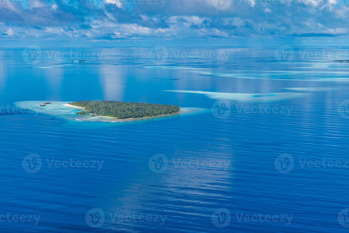 Aerial view on Maldives island, Ari atoll. Tropical islands and atolls in Maldives from aerial view. Summer vacation holiday landscape background. photo