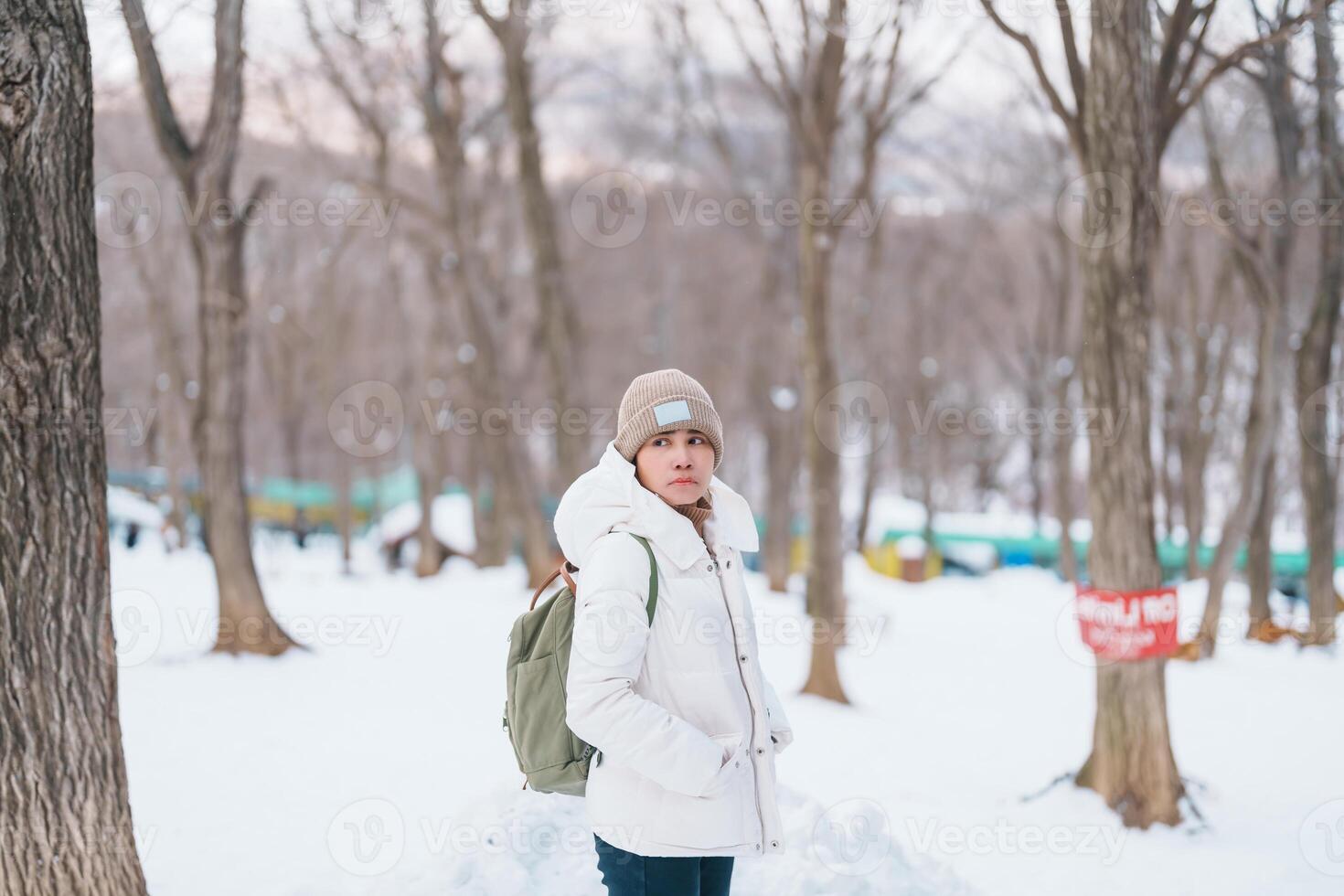 Woman tourist with snow in winter season at Zao fox village, traveler sightseeing Miyagi prefecture. landmark and popular for attraction near Sendai, Tohoku, Japan. Travel and Vacation photo