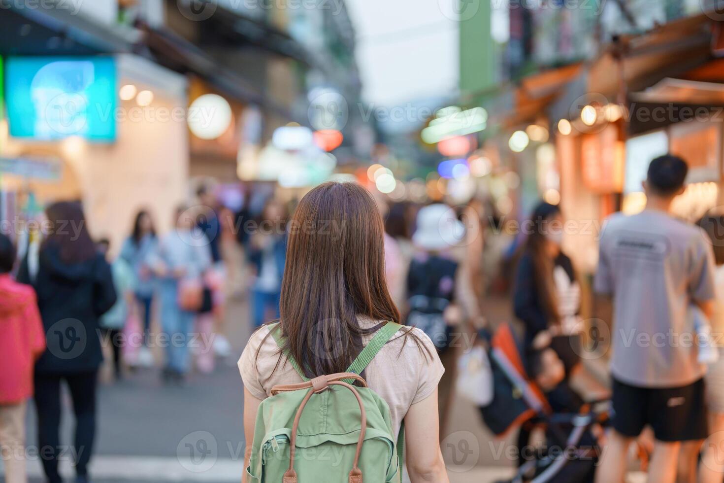 woman traveler visiting in Taiwan, Tourist with bag sightseeing and Shopping in Shilin Night Market, landmark and popular attractions in Taipei city. Asia Travel and Vacation concept photo