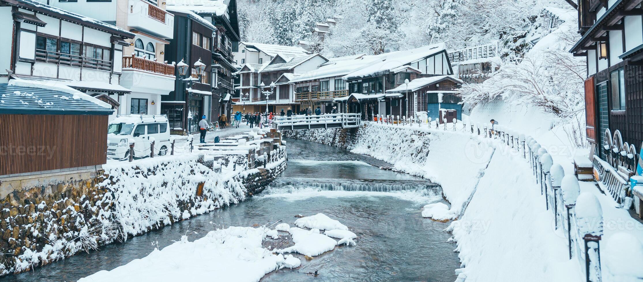 Beautiful Ginzan Onsen with snow fall in winter season is most famous Japanese Hot Spring in Yamagata, Japan. photo