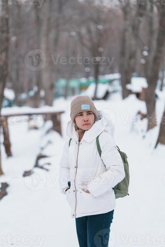 Woman tourist with snow in winter season at Zao fox village, traveler sightseeing Miyagi prefecture. landmark and popular for attraction near Sendai, Tohoku, Japan. Travel and Vacation photo