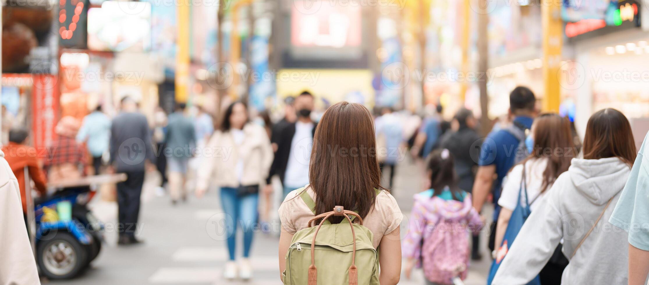 woman traveler visiting in Taiwan, Tourist with bag sightseeing and Shopping in Ximending street Market, landmark and popular attractions in Taipei city. Asia Travel and Vacation concept photo