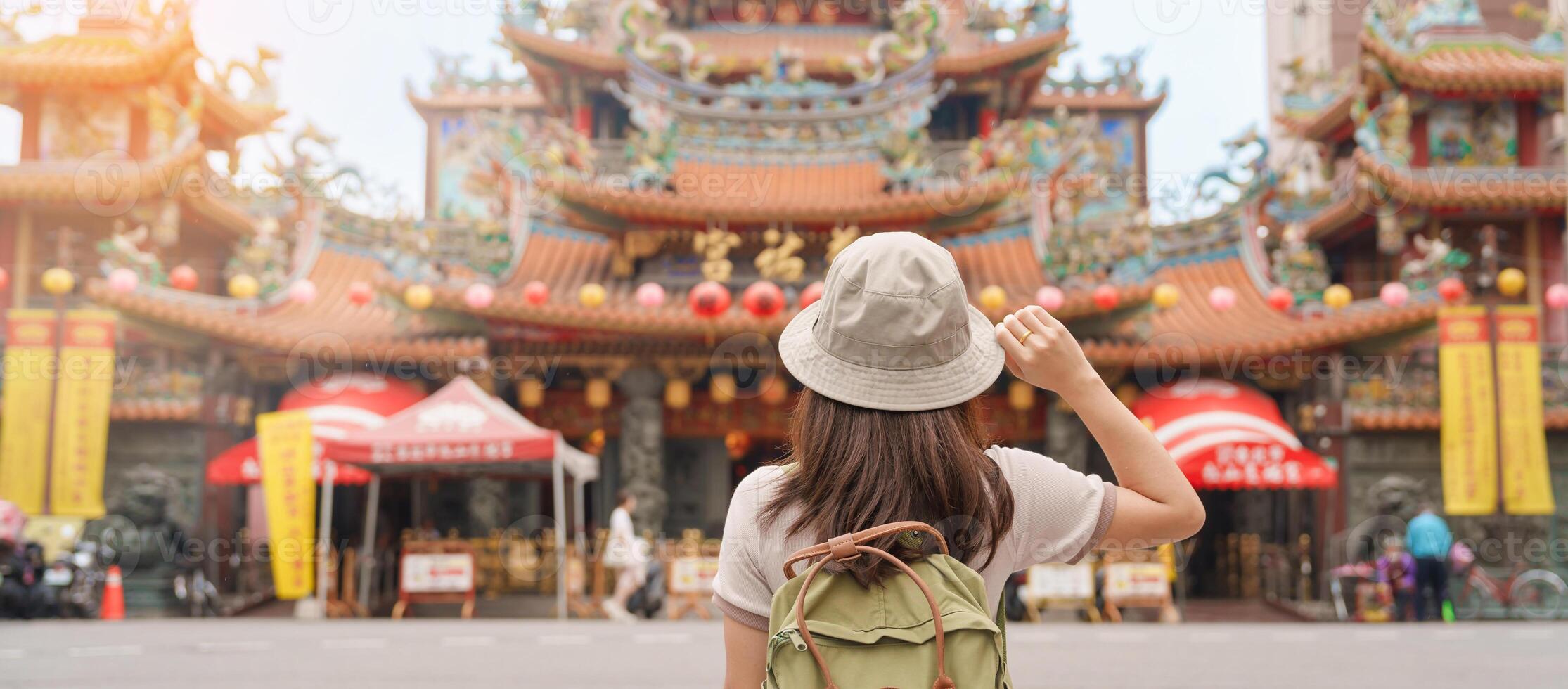 woman traveler visiting in Taiwan, Tourist sightseeing in Songshan Ciyou Temple, near Raohe Night Market, Songshan District, Taipei City. landmark and popular. Travel and Vacation concept photo