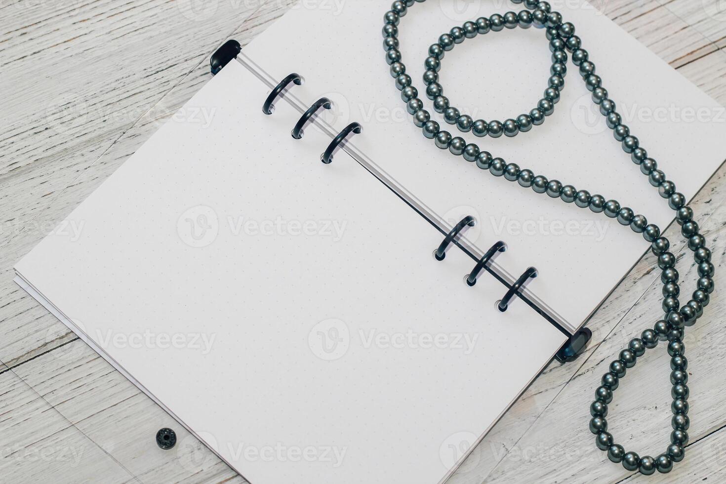 Notebook with rings, checkered sheets, transparent cover, beads, style concept photo