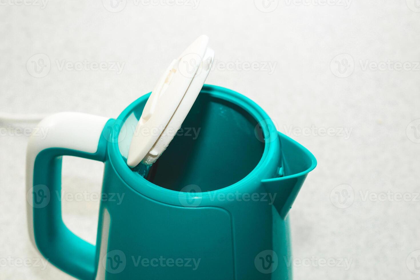 Close-up of an electric kettle that heats water, scum from water. photo