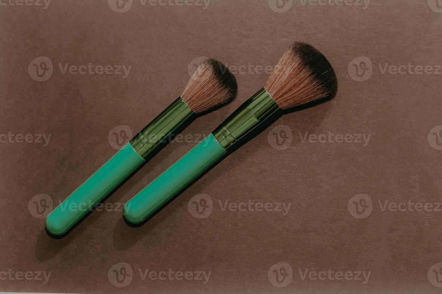 Green make-up bones on a dark background. photo