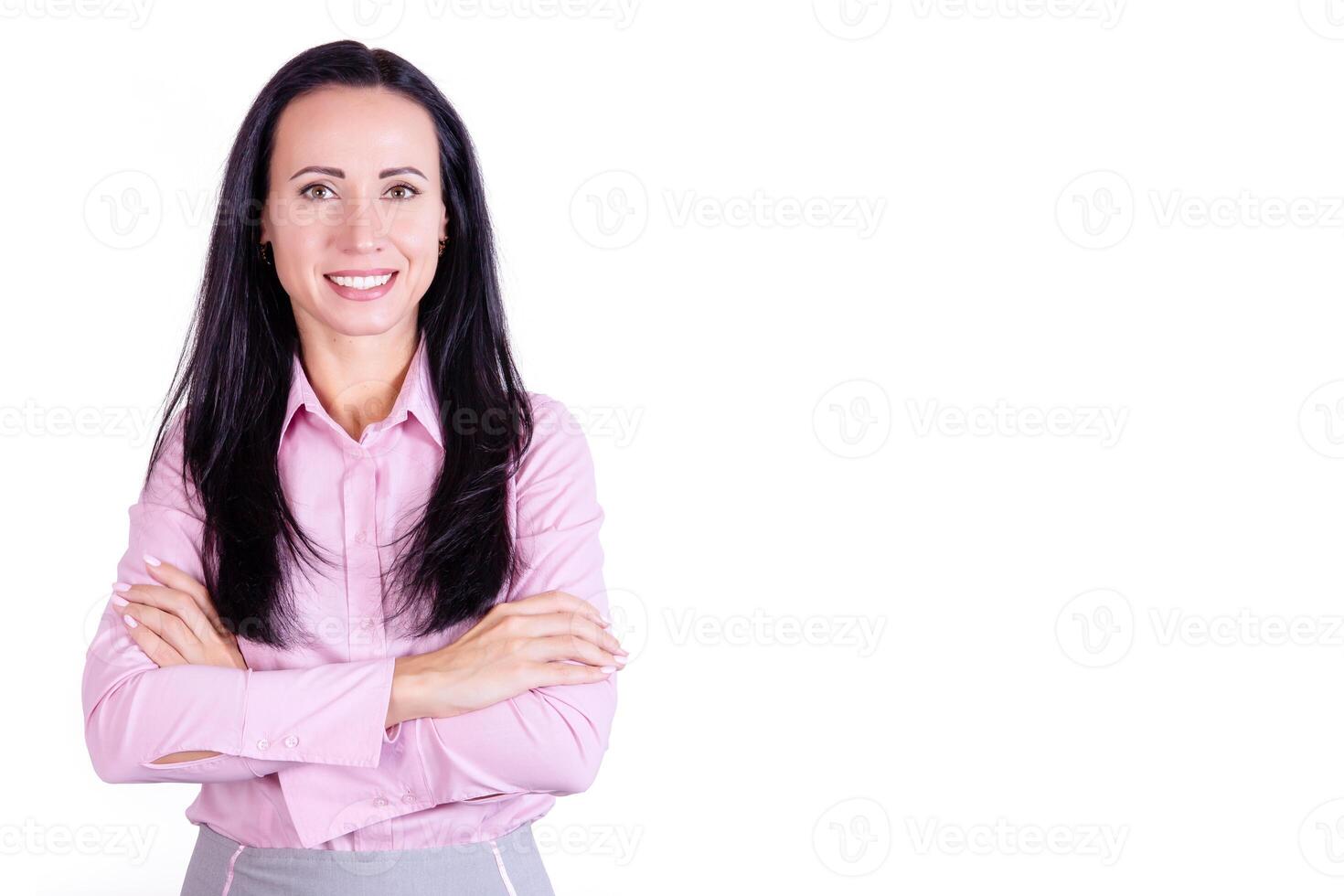 Portrait of a smiling, young attractive business woman in a pink shirt with her arms crossed. Business lady photo