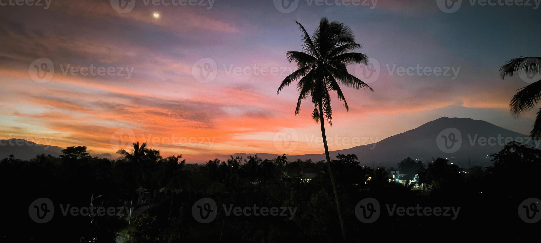 A view at dusk, when the sun is about to set photo
