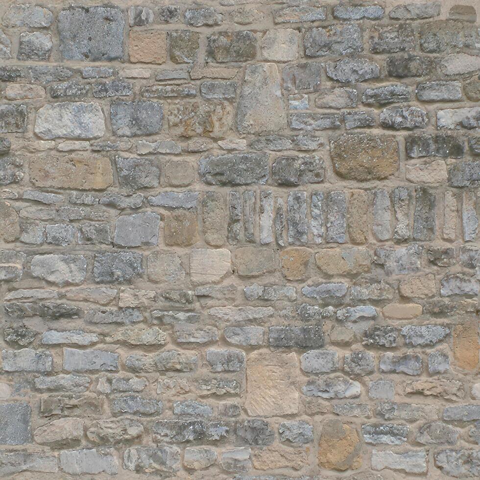 Old wall stone texture and background with rustic tiles design photo