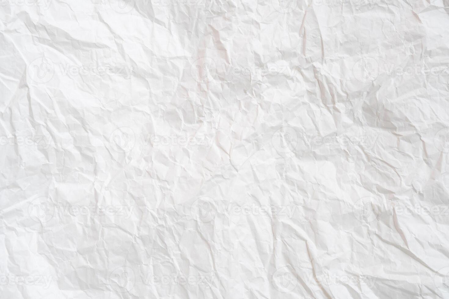 Wrinkled or crumpled white stencil or tissue paper used for crumpled paper background texture. photo