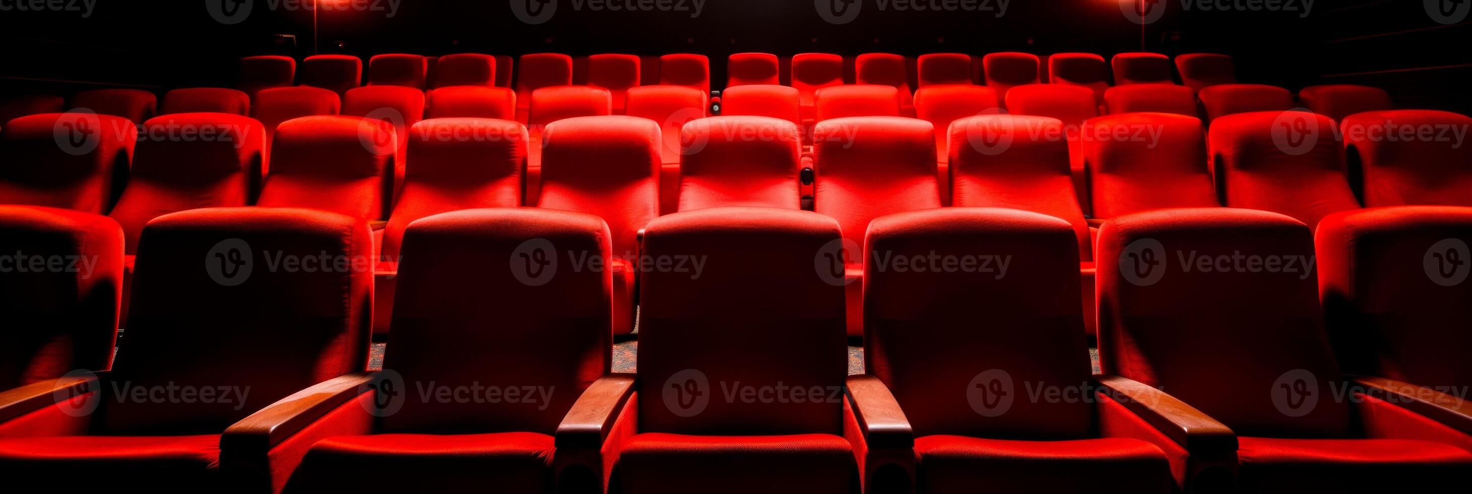 AI Generated  Empty cinema seats in a dark theater with ambient lighting.Venue advertising, cultural event brochures photo