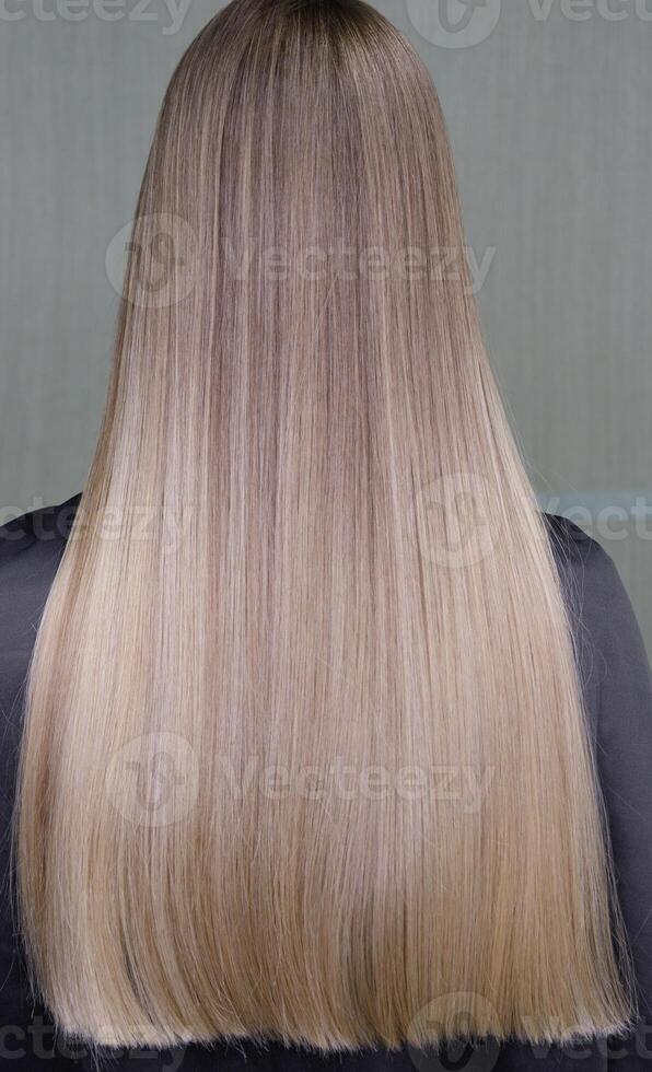 Stunningly beautiful hair models painted in a light color look from the back. selective focus.High quality photo