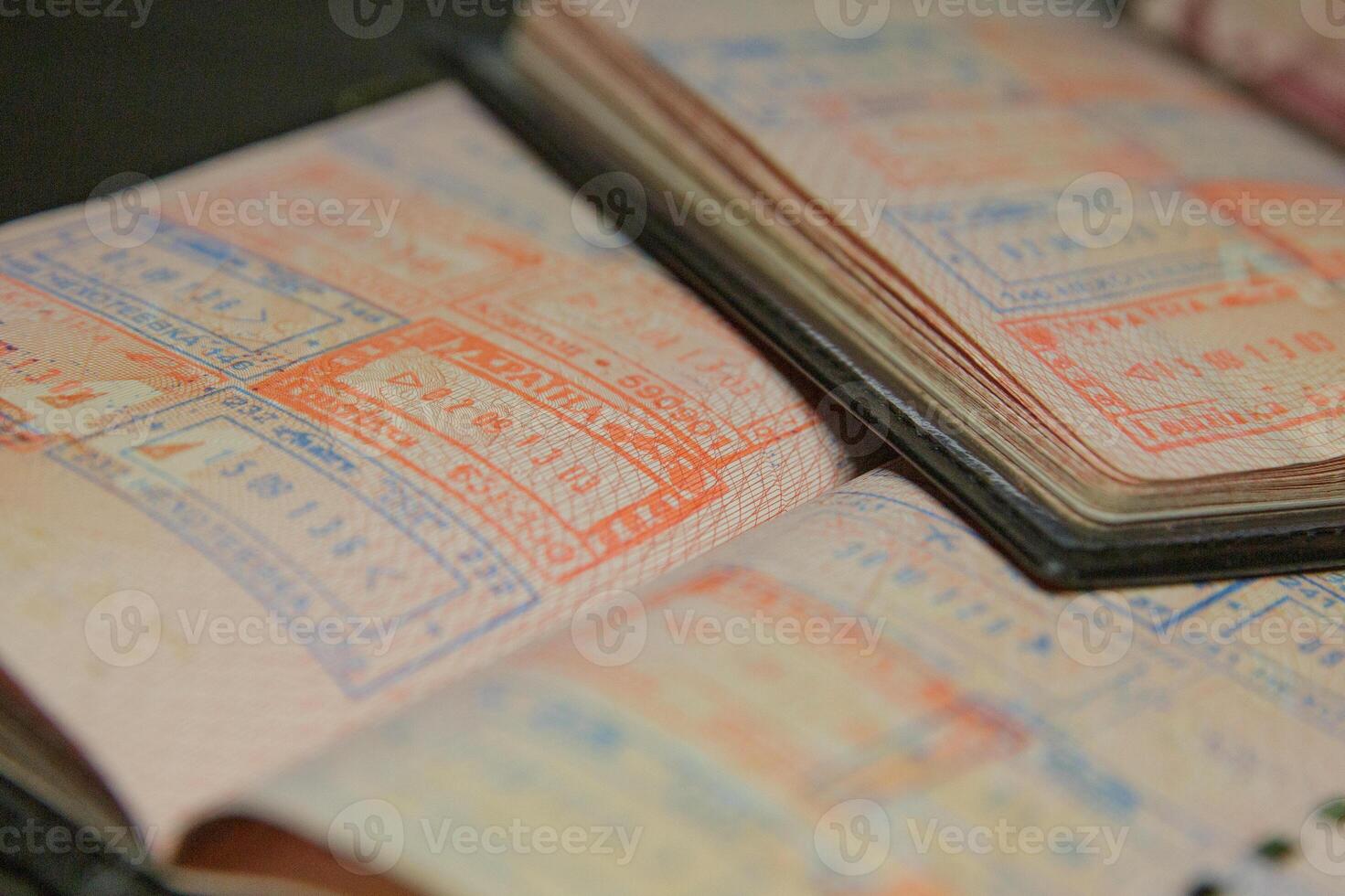 open passport pages with marks and stamps on crossing the border. selective focus.High quality photo