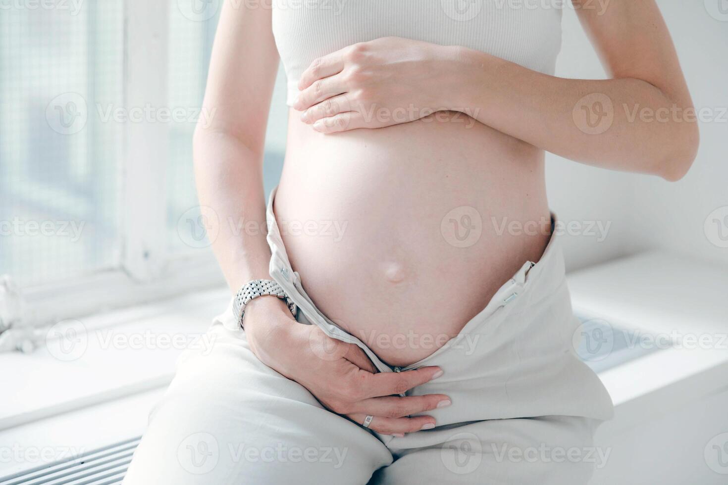 Pregnant woman close view. Pregnancy background photo