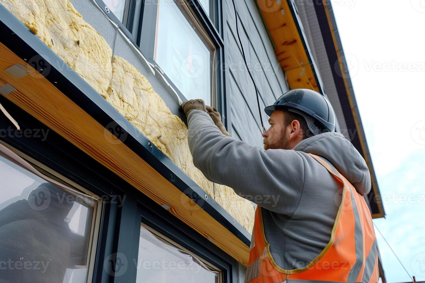 AI Generated Worker applies insulation with glass wool for energy saving on a new construction site. Generative AI photo