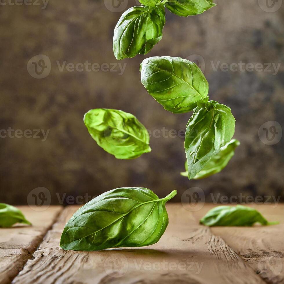 flying fresh natural basil leaves on wooden backdrop photo