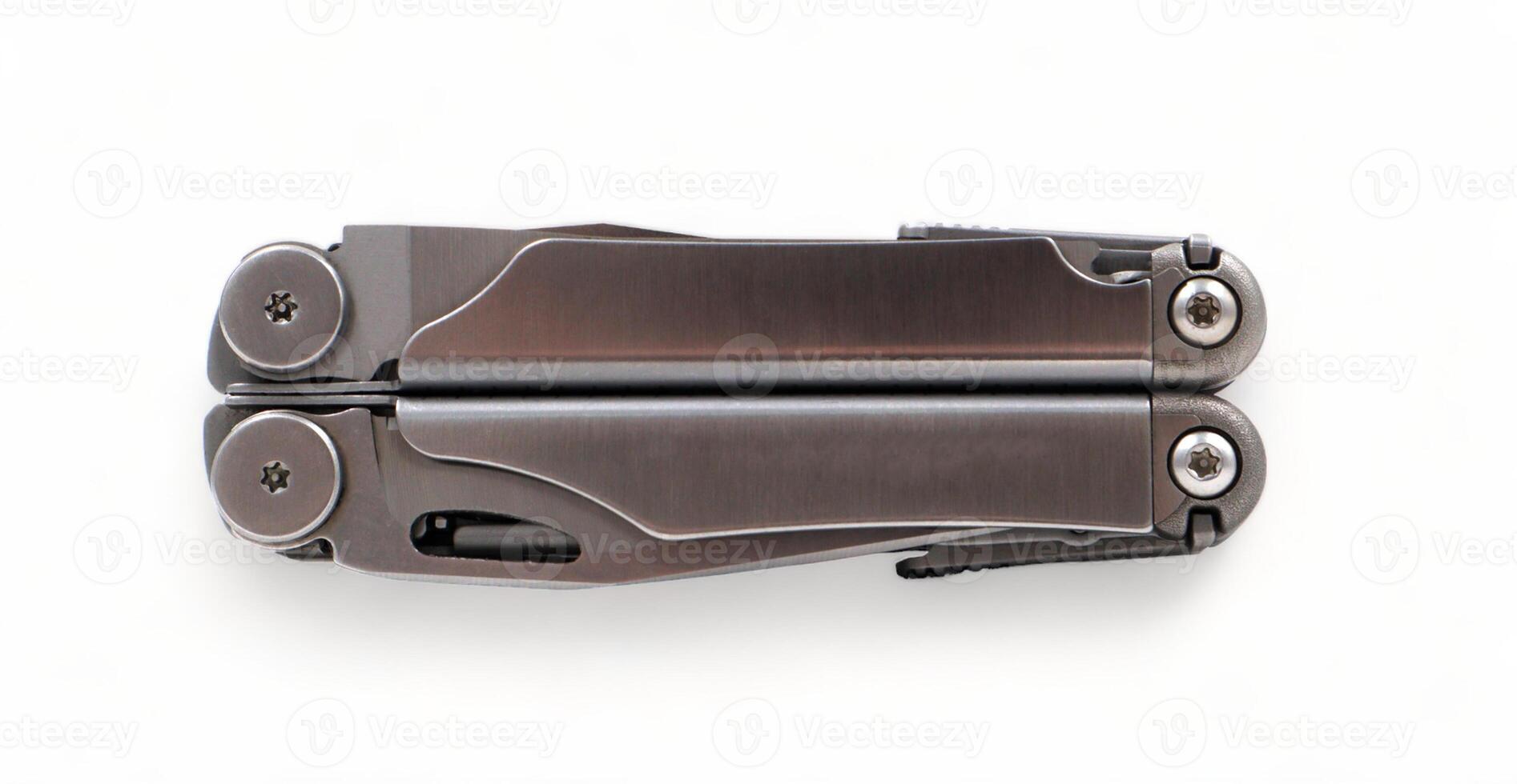 Folded steel multitool isolated on white background, top view. A tool for daily practice. All in one. Construction and repair. Compact and portable product. Pocket knife. EDC concept. photo