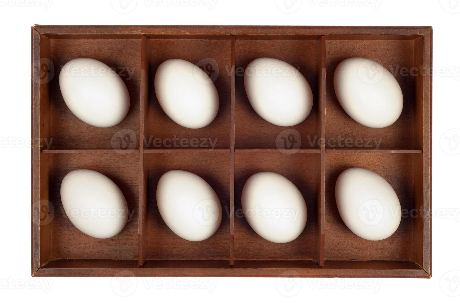 Eggs in wooden box photo