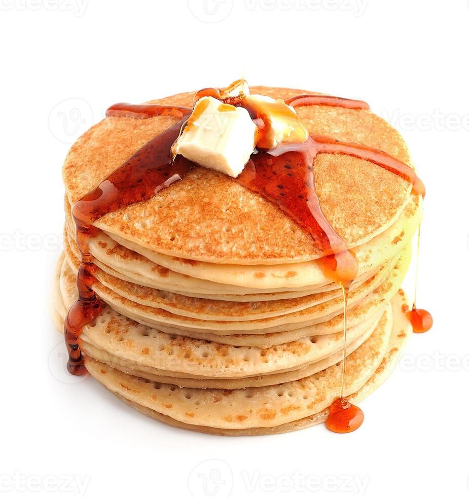 Pancakes with butter and maple syrup close up . photo