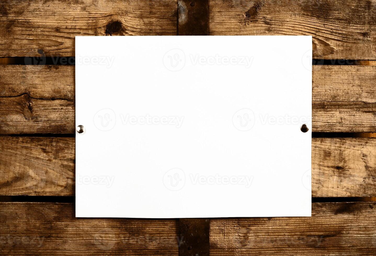 Blank paper on wooden wall photo