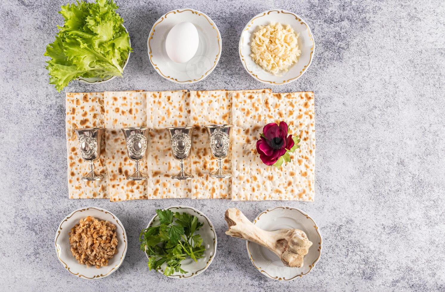 Traditional treats for the Jewish Passover holiday on a marble gray background. Top view. Flat lay. A copy space. Passover holiday concept. photo