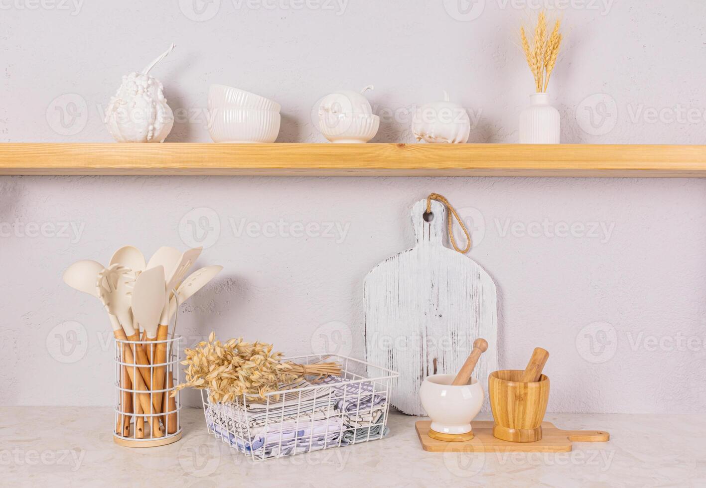 Front view of an open wooden shelf and kitchen countertop with eco-friendly kitchen utensils and a bouquet of ears of corn. Eco-friendly cuisine. photo