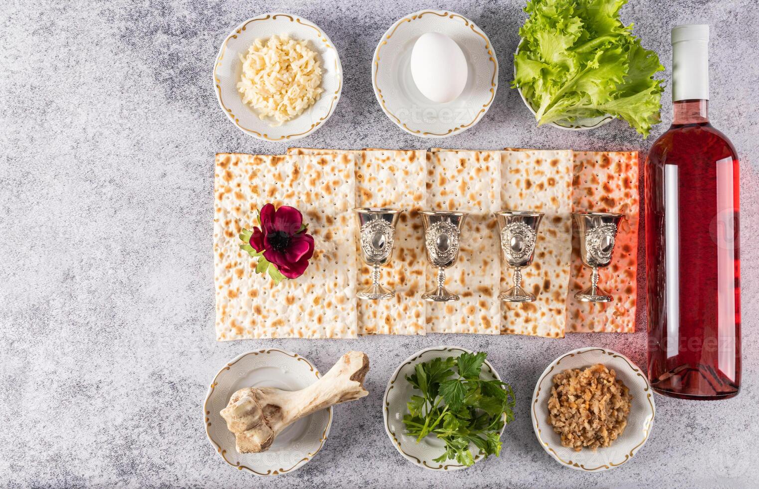 Beautiful festive background with traditional Jewish Passover treats on grey marble background. Top view. Flat layout. A copy space. photo