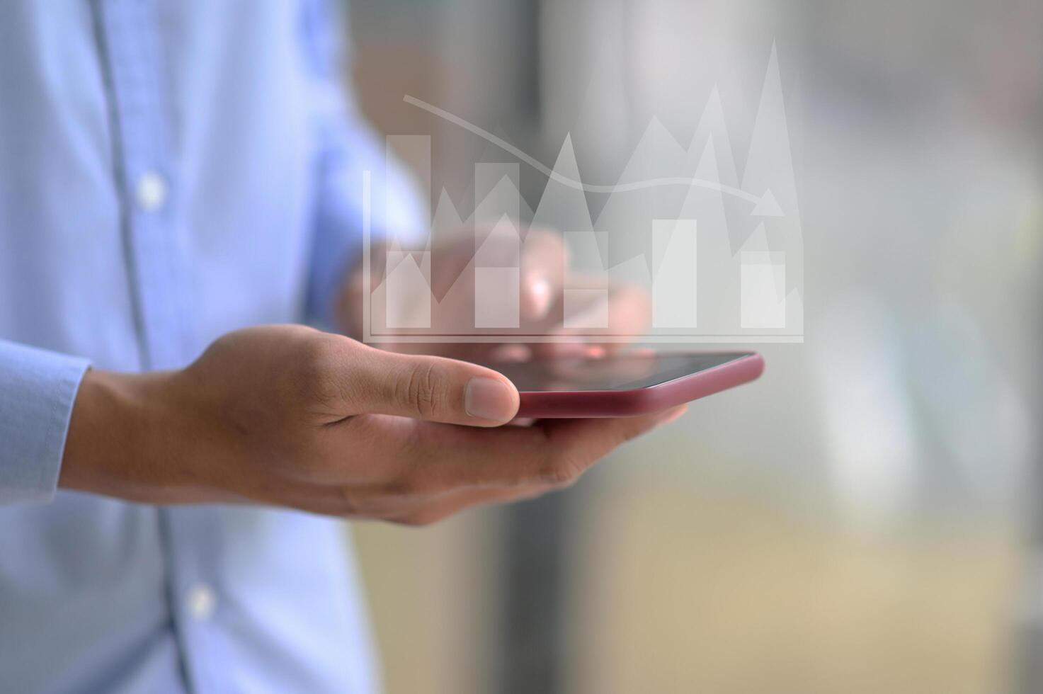 Close-up shot of A businessman using a smartphone. photo