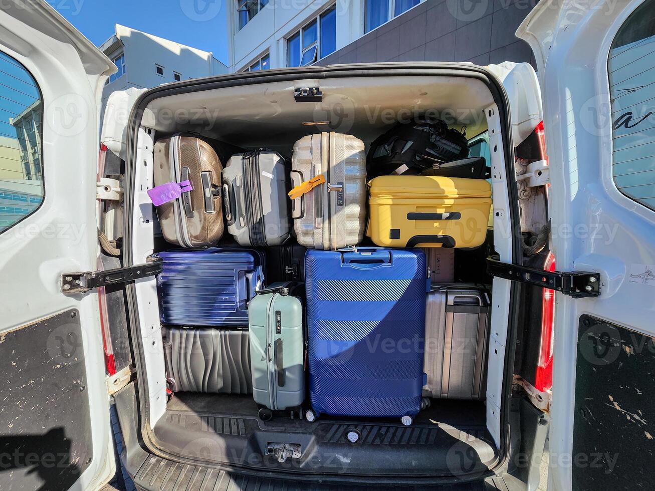 Large van full of luggage and backpack preparing for family holidays photo