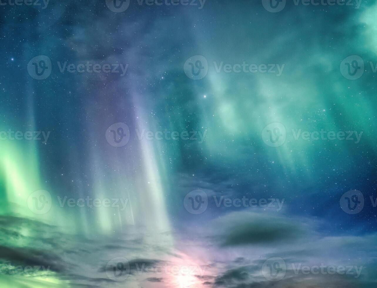 Beautiful Aurora borealis and starry glowing in the night sky on arctic circle photo