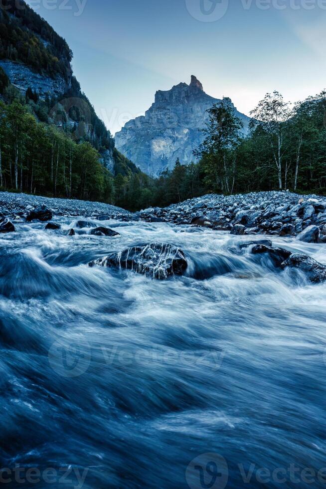 French Alps landscape of Cirque du Fer a Cheval with river flowing in the valley at Sixt Fer a Cheval, France photo