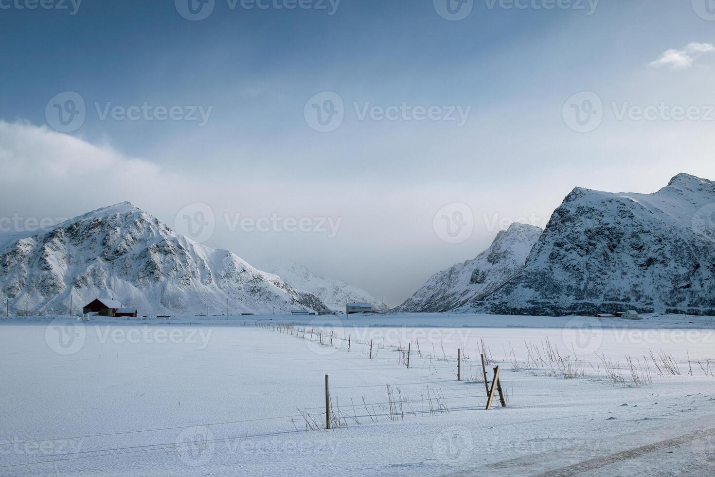 Scenery of snow mountain range with overcast sky in winter photo