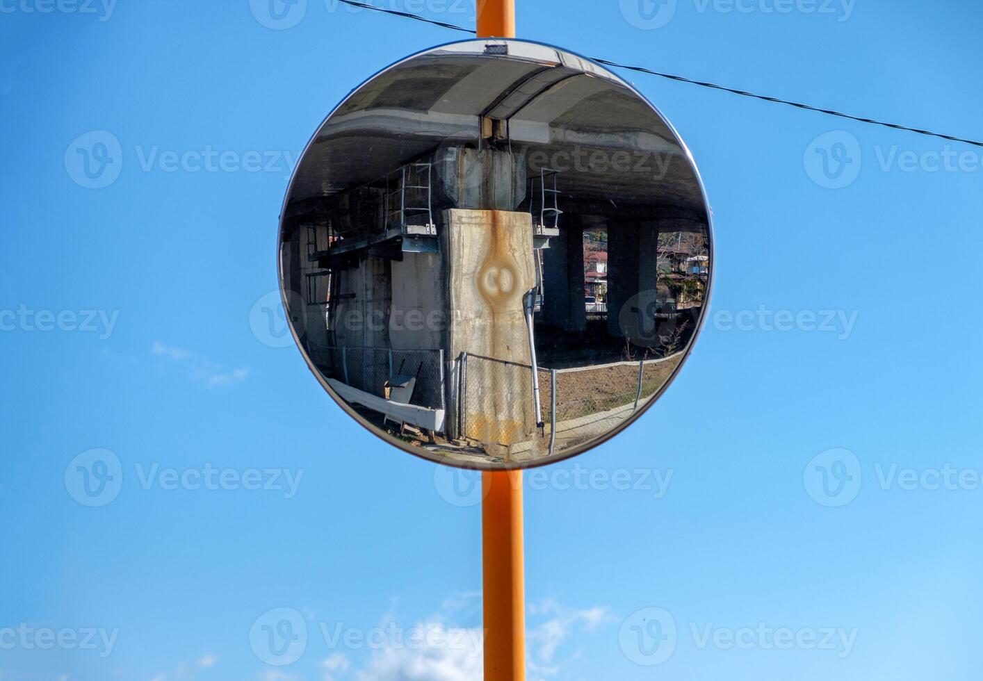 Glass reflection rounded signal traffic on blue sky photo