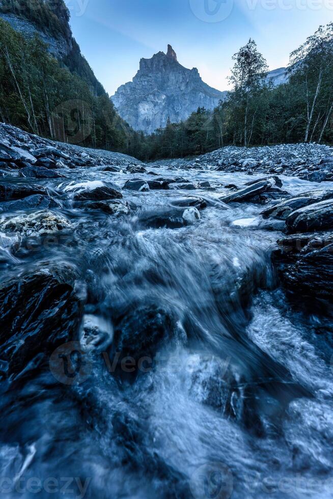 French Alps landscape of Cirque du Fer a Cheval with river flowing in the valley at Sixt Fer a Cheval, France photo
