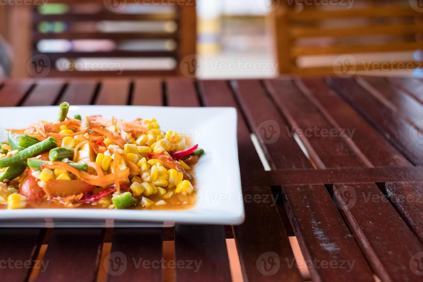 Corn seeds with fruits and vegetables sour spicy in plate photo