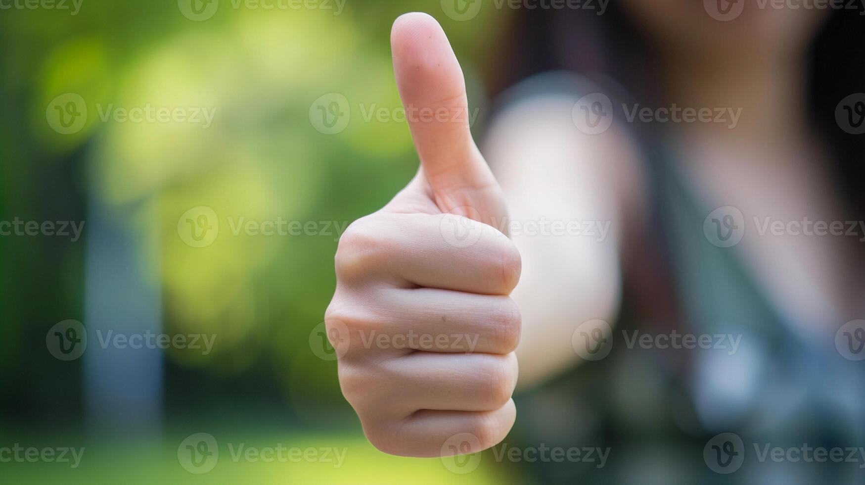 AI generated A close-up of a woman's hand giving a thumbs up in a supportive gesture, background image, generative AI photo