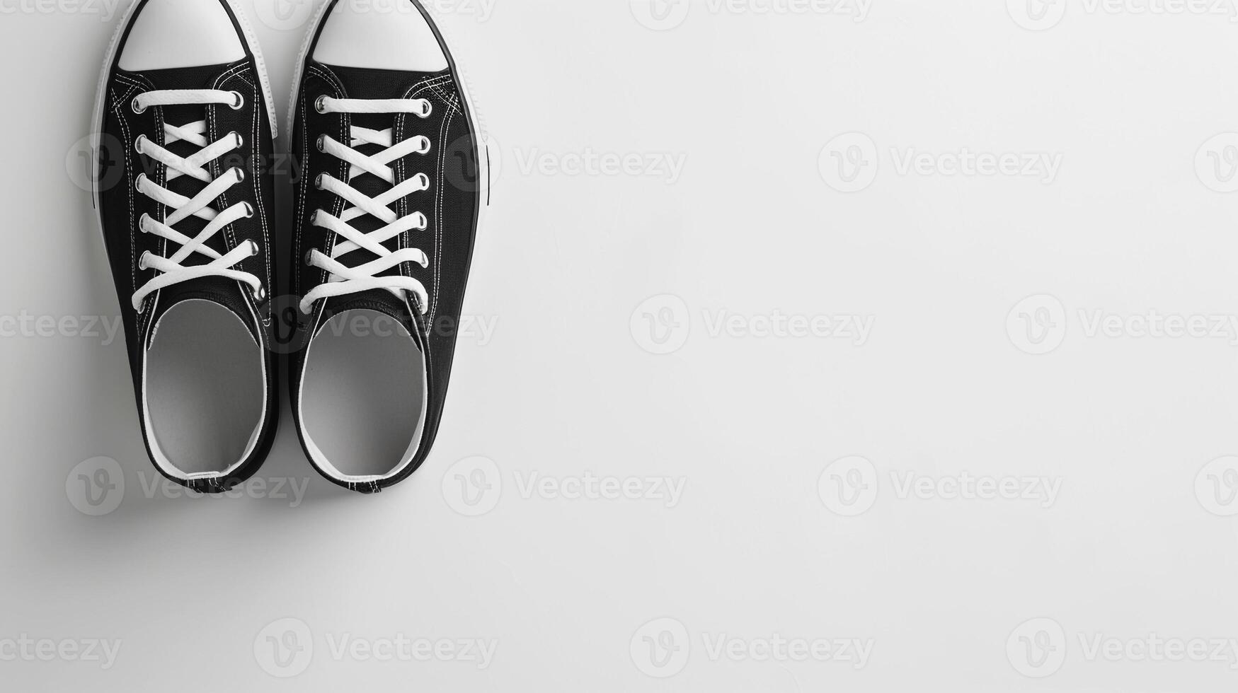 AI generated Black canvas shoes isolated on flat white background with copy space for advertisement. Generative AI photo