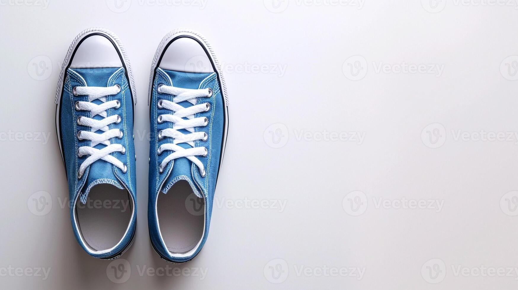 AI generated Blue canvas shoes isolated on flat white background with copy space for advertisement. Generative AI photo