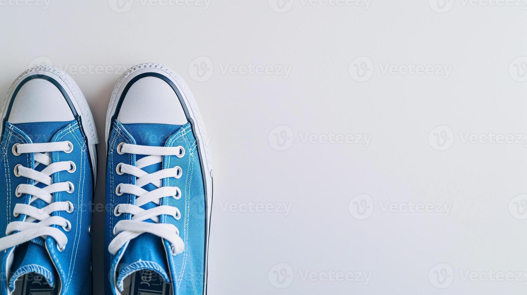 AI generated Blue canvas shoes isolated on flat white background with copy space for advertisement. Generative AI photo