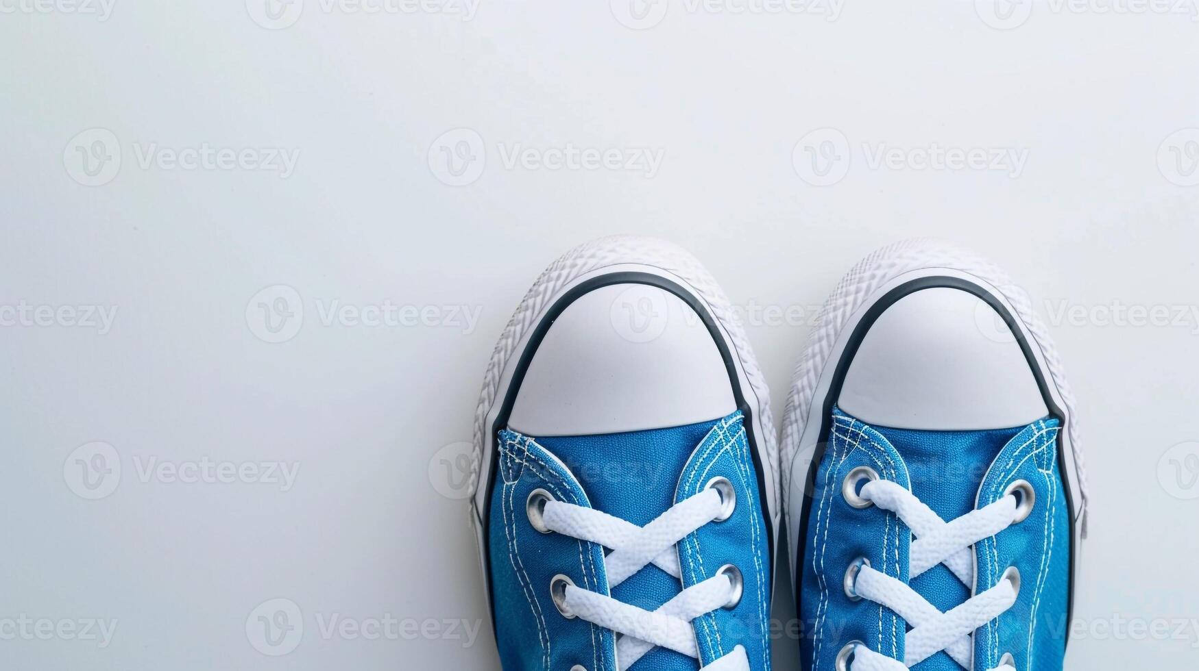 AI generated Blue canvas shoes isolated on flat white background with copy space for advertisement. Generative AI photo