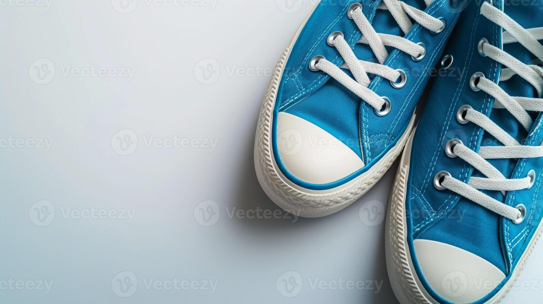 AI generated Blue canvas shoes isolated on flat white background with copy space for advertisement. Generative AI photo