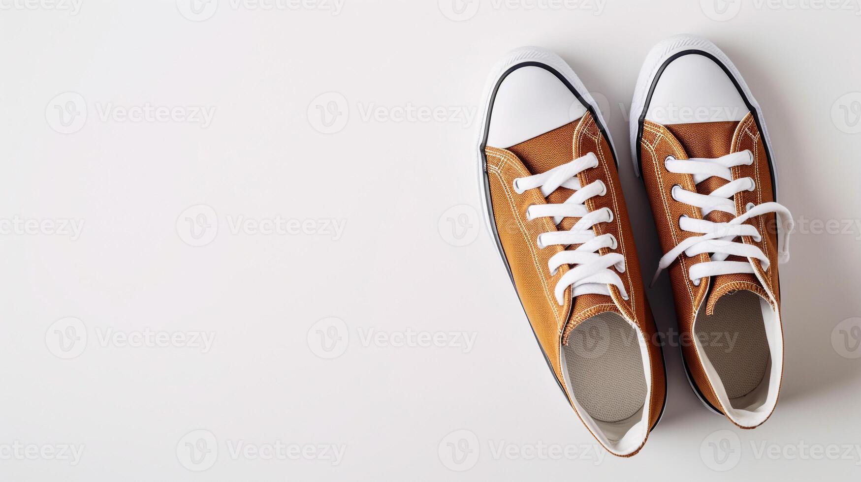 AI generated Brown canvas shoes isolated on flat white background with copy space for advertisement. Generative AI photo